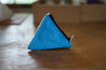 A Small pyramid shaped pouch made from white and blue upcycled sailboat sail