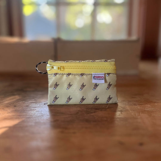 A Yellow Trail wallet standing upright