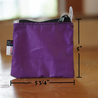 A small purple rectangle pouch made from upcycled sailboat sail with dimensions overlaid onto image