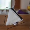 A small white pyramid pouch made from upcycled sailboat sail with dimensions overlaid 